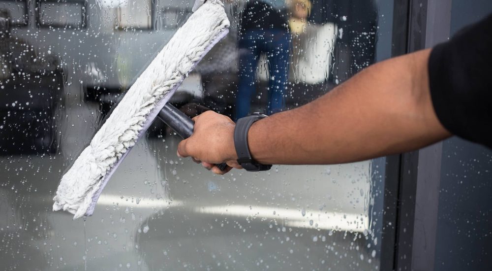 Cleaning windows with a squeegee